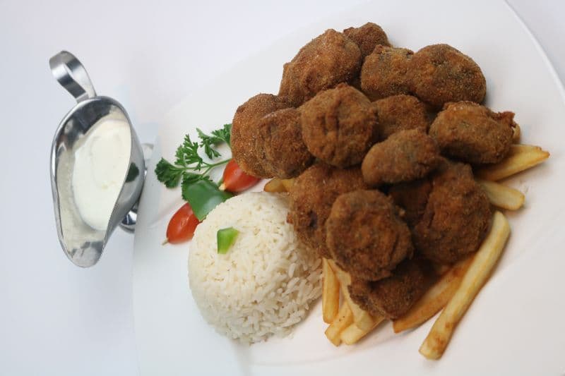 Breaded Mushrooms with French fries, rice and tartar sauce.