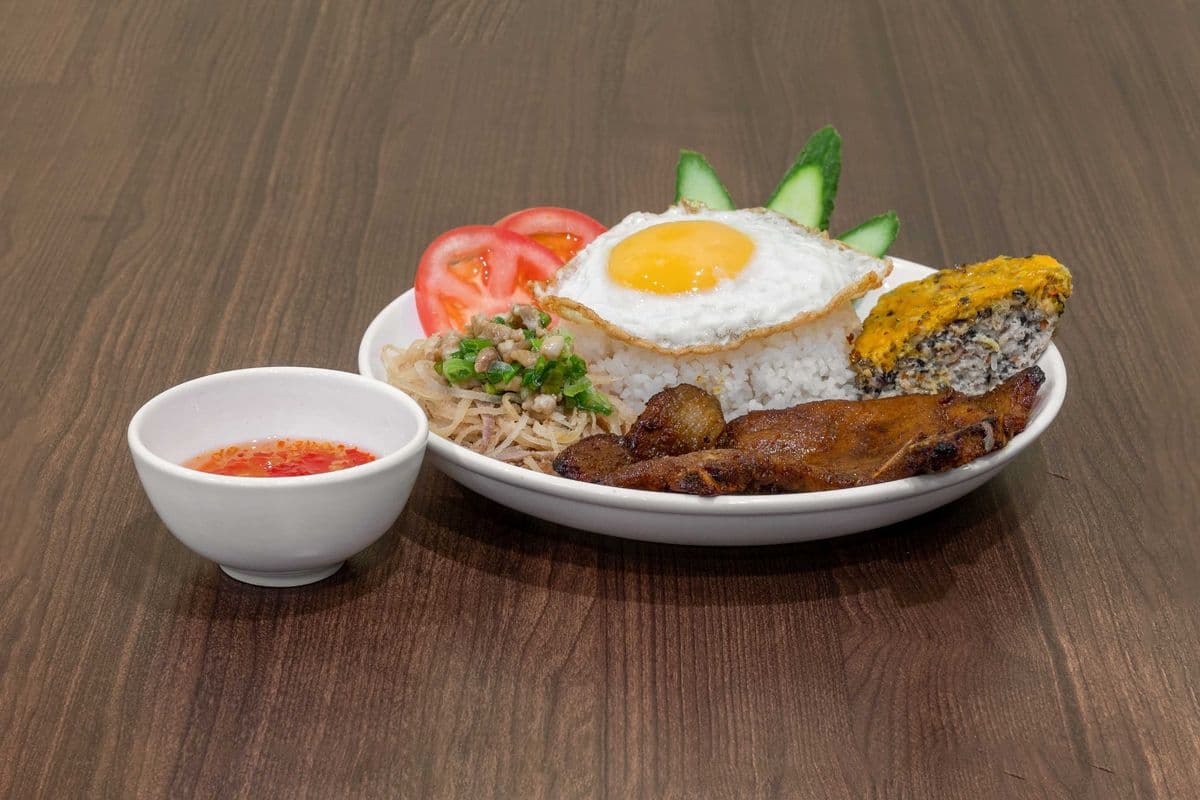 Grilled Pork Chop, Pork Skin, Meatloaf, and Fried Egg (Cơm tấm sườn nướng, bì, chả trứng, trứng chiên)