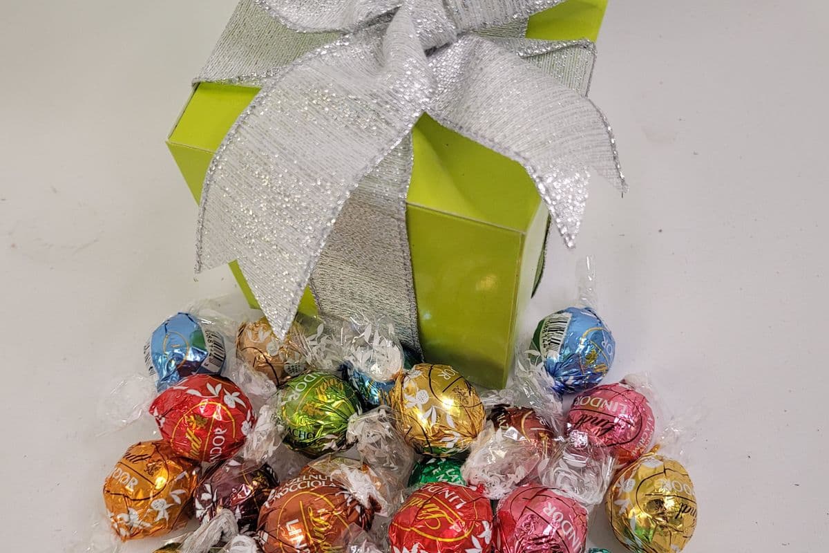 Assorted Lindt LINDOR Truffles in a 4"x4"x4" gift box with festive ribbon