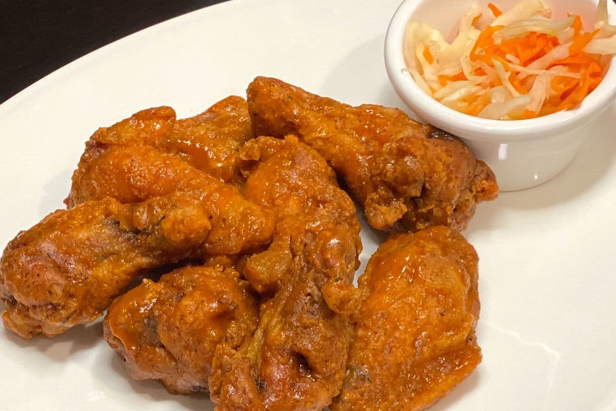 A2S. Hand tossed in Sauce Chicken Wings