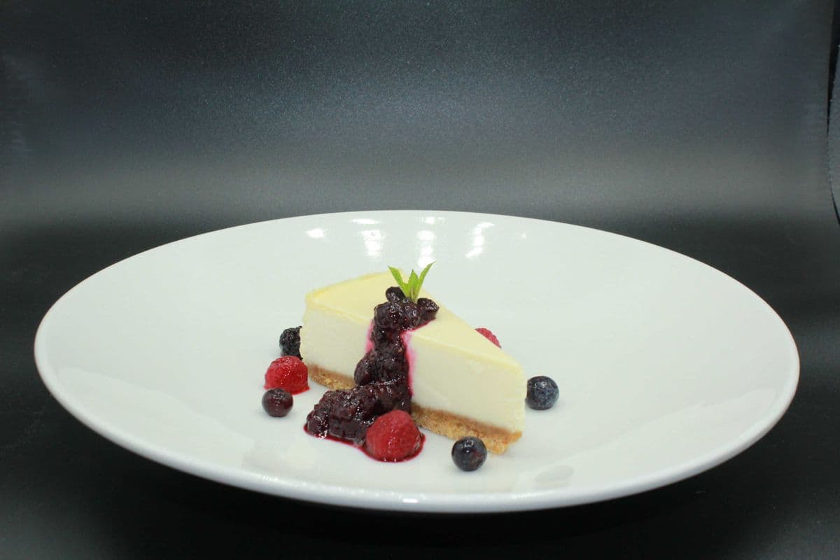 New York Cheese Cake Served with Berry Coulis