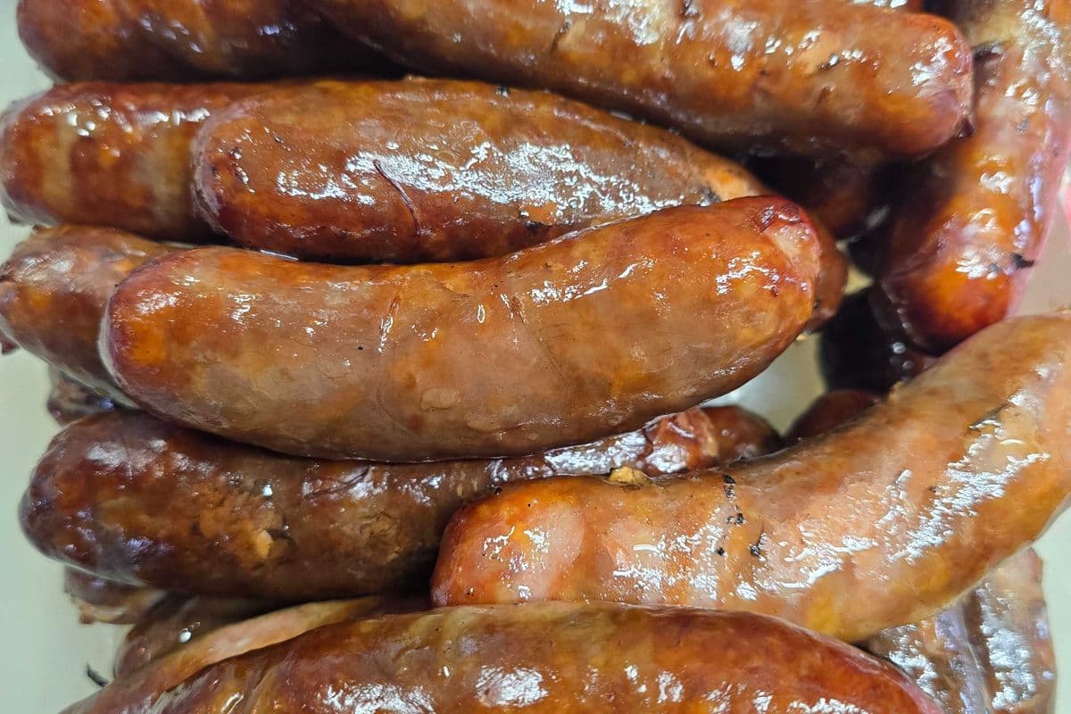 House smoked Maple garlic sausage on a bun topped your way, served with seasoned fries & pop or H20 Gluten free in options