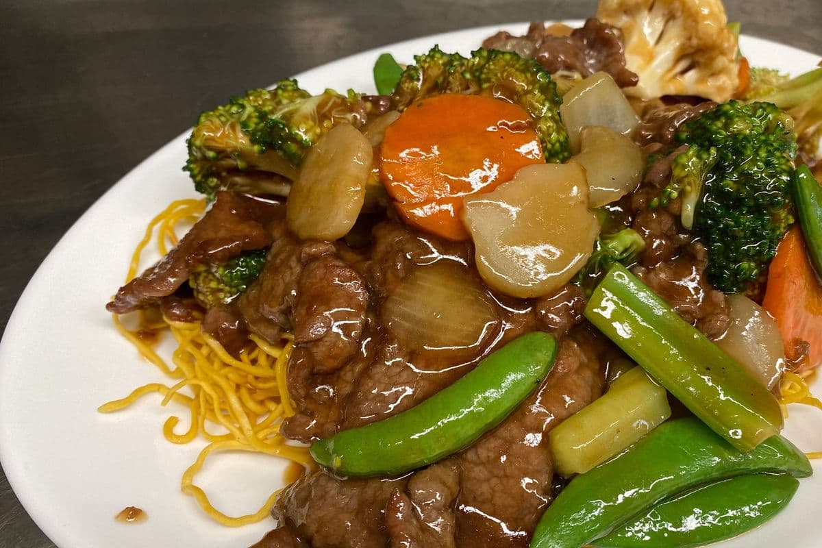 Beef and Mixed Greens On Fried Noodles