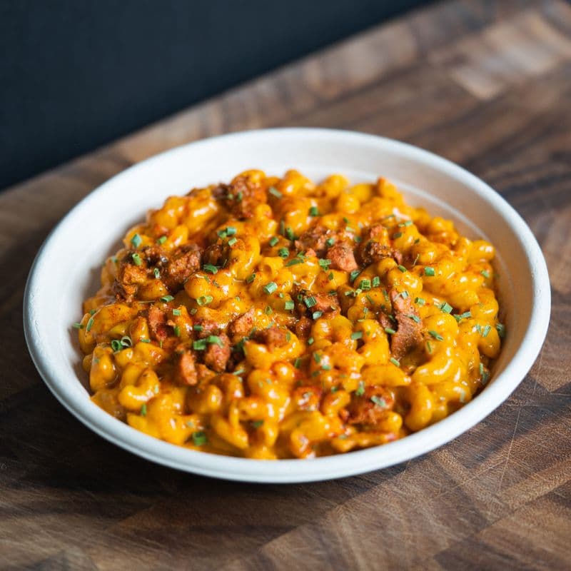 with 4oz Achari Coleslaw Salad On The Side - Butter Chicken Mac N' Cheese