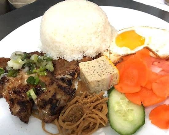 C19. Grilled Chicken, Pork Chop, Steamed Egg, Fried Egg, and Shredded Pork with Steamed Broken Rice