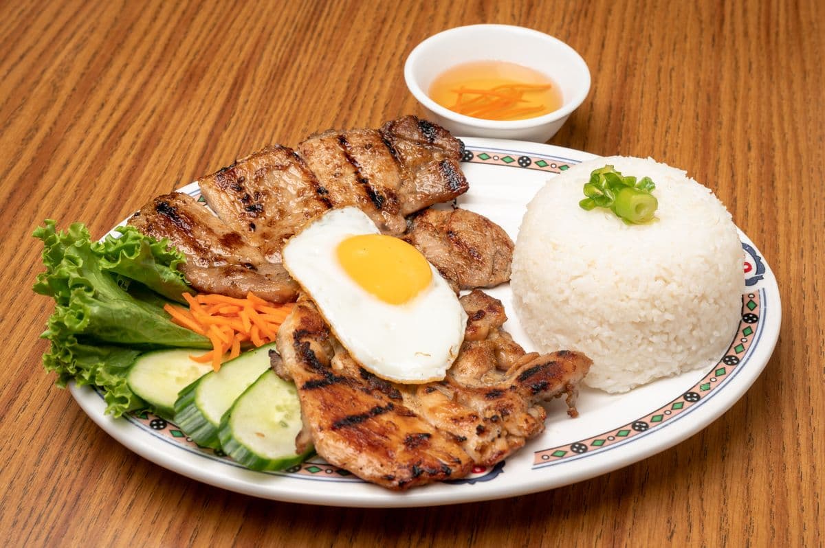 Grilled Chicken, Pork Chop, and Fried Egg on Rice