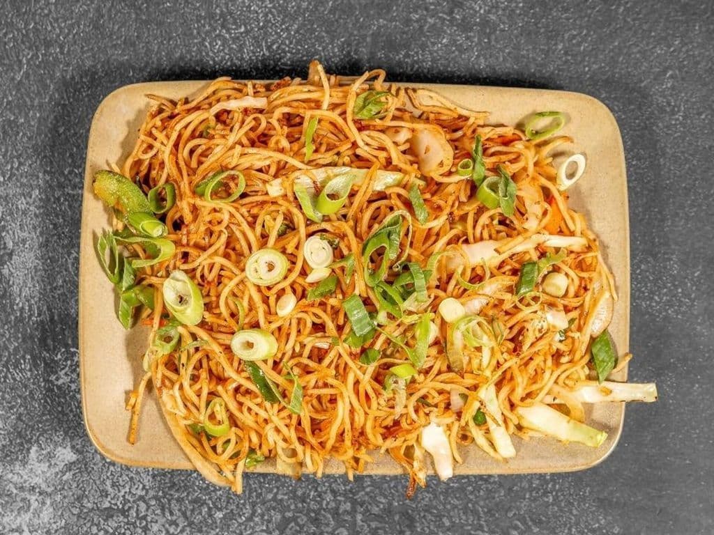 Triple Schezwan Veg Noodles