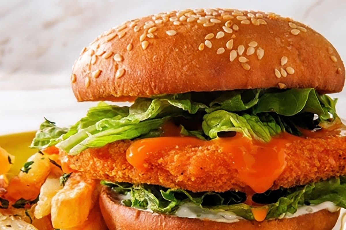 Crispy chicken buffalo bacon cheese burger with fries