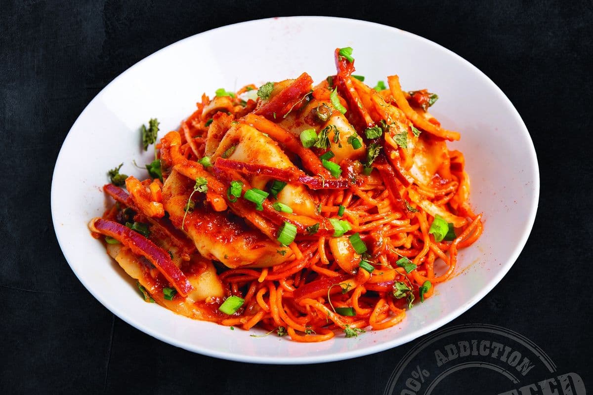Chili Momos on Cheesy Tandoori Noodles