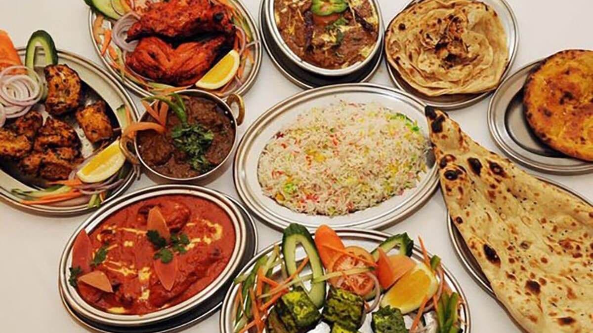 Any 4 Large Dishes + 12 Naans (total)+  Large Green Salad +Raita 