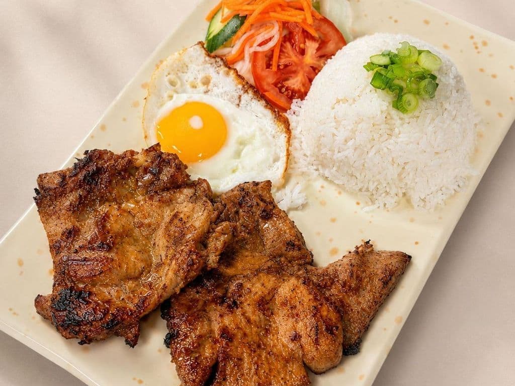 501. Grilled Chicken, Pork Chop and Fried Egg on Rice