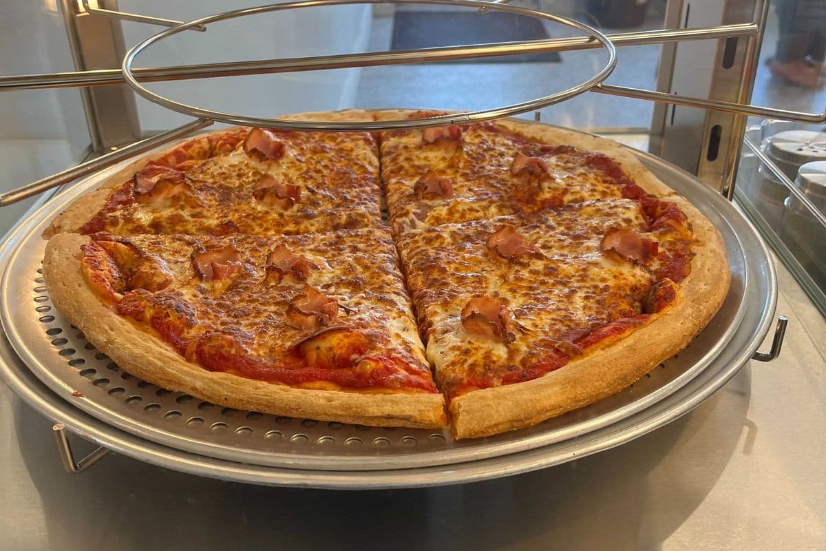 2 Pizza Slices and 2 Cans of Pop + 2 Cheddar Dip's