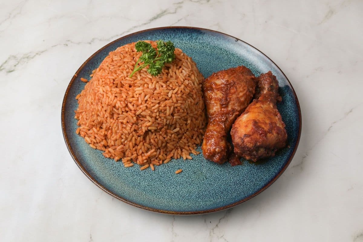 Plate of Jollof Rice and Two Chicken Drums