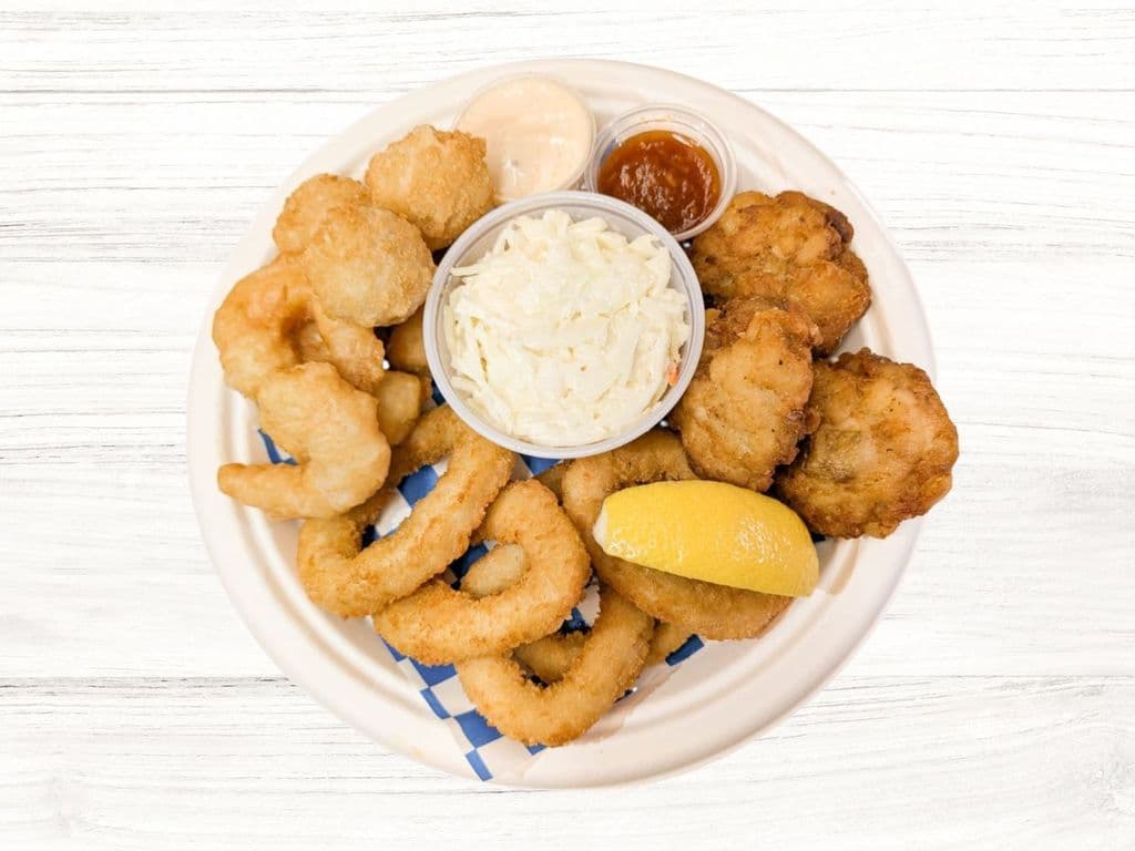 Seafood Sampler: 5Pc Calamari, 5Pc Scallops, 5Pc Shrimps, 3Pc FishBites & Sm Coleslaw