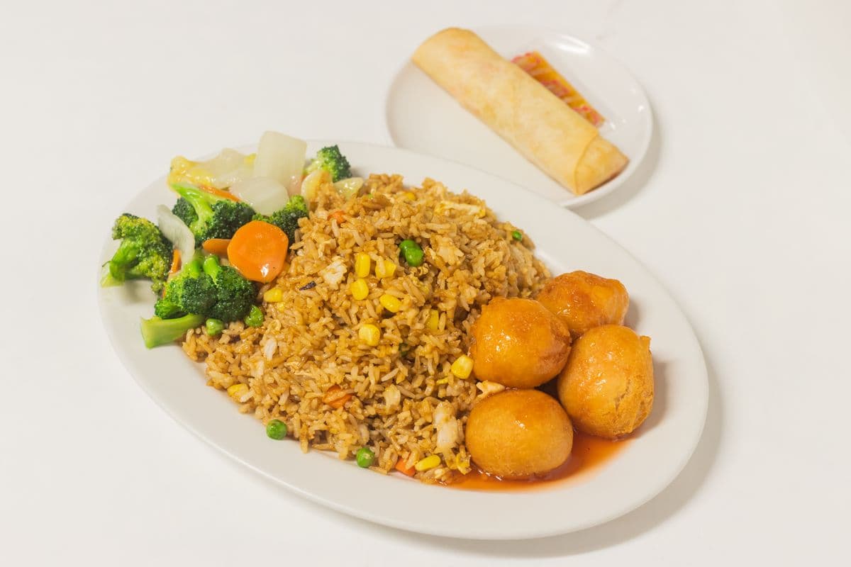 D. Sweet-And-Sour Chicken Balls Comes with Fried Rice, Mixed Greens, and Egg Roll or Consomme Soup