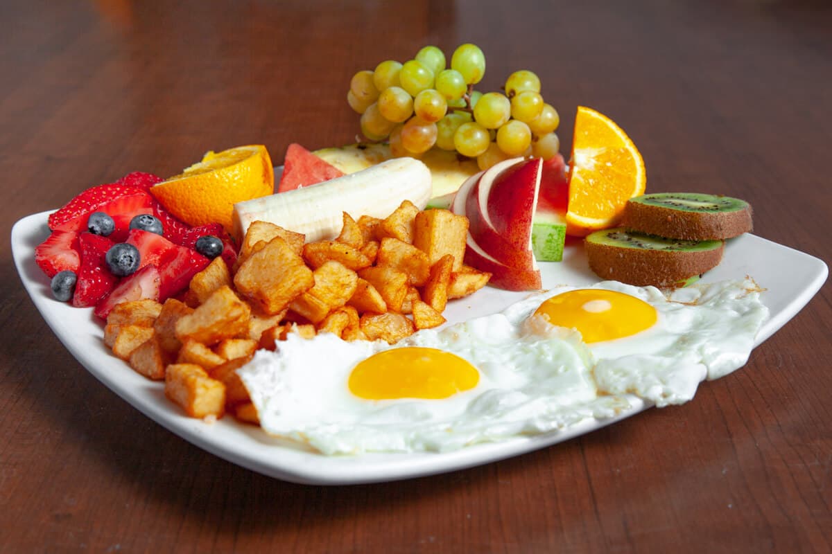 Two Eggs with Beautiful Fruit Plate