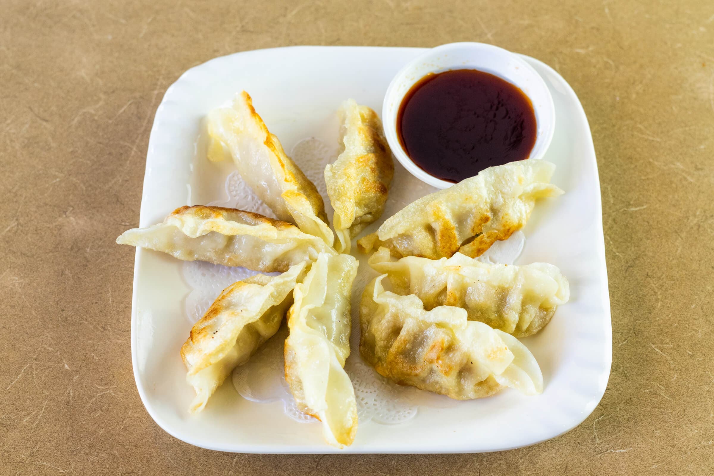 23. Grilled Pork Dumplings (8 pcs)