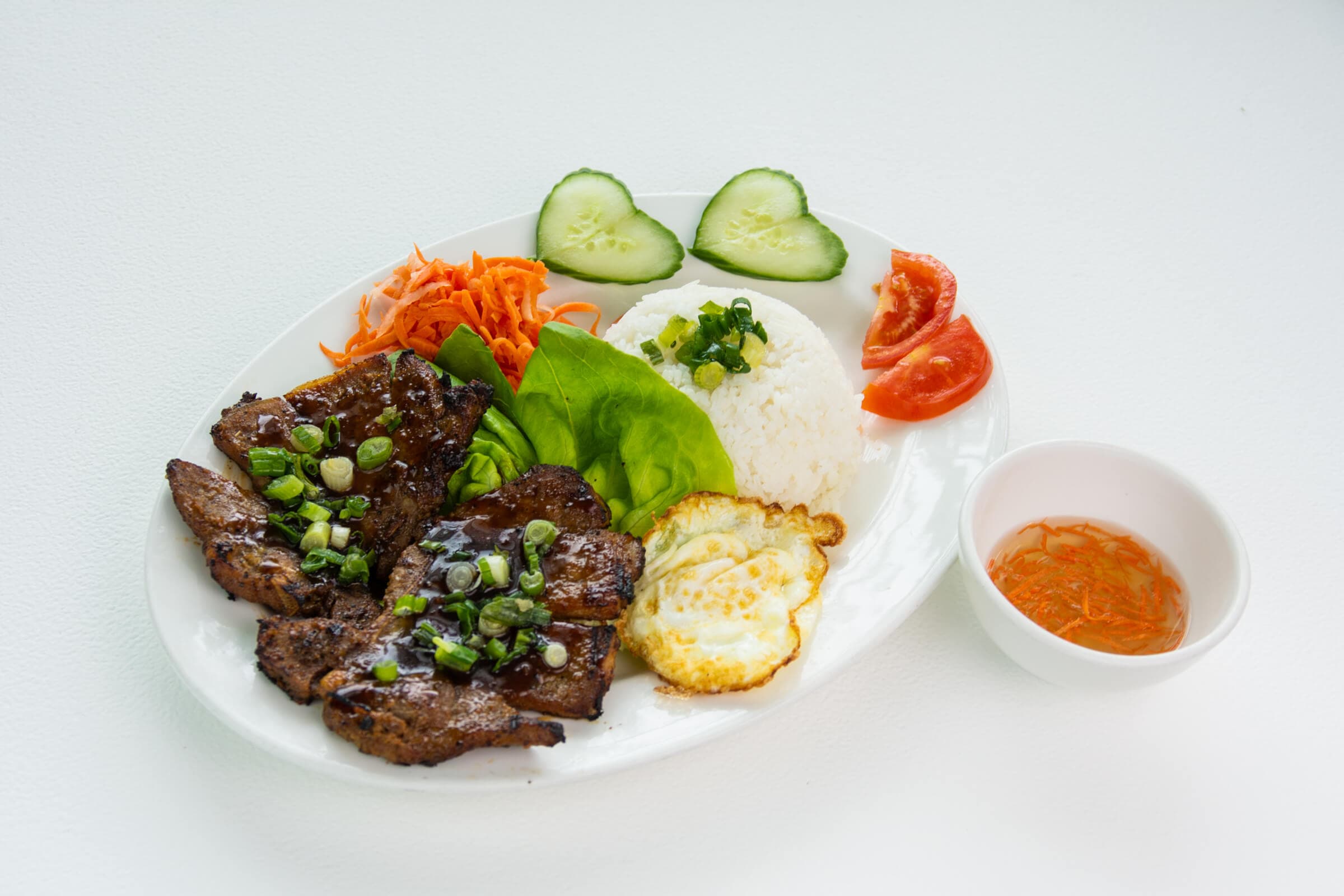 49. Grilled Pork Chop and Eggs on Steamed Rice - Com Suon Nuong Xa Trung Chien