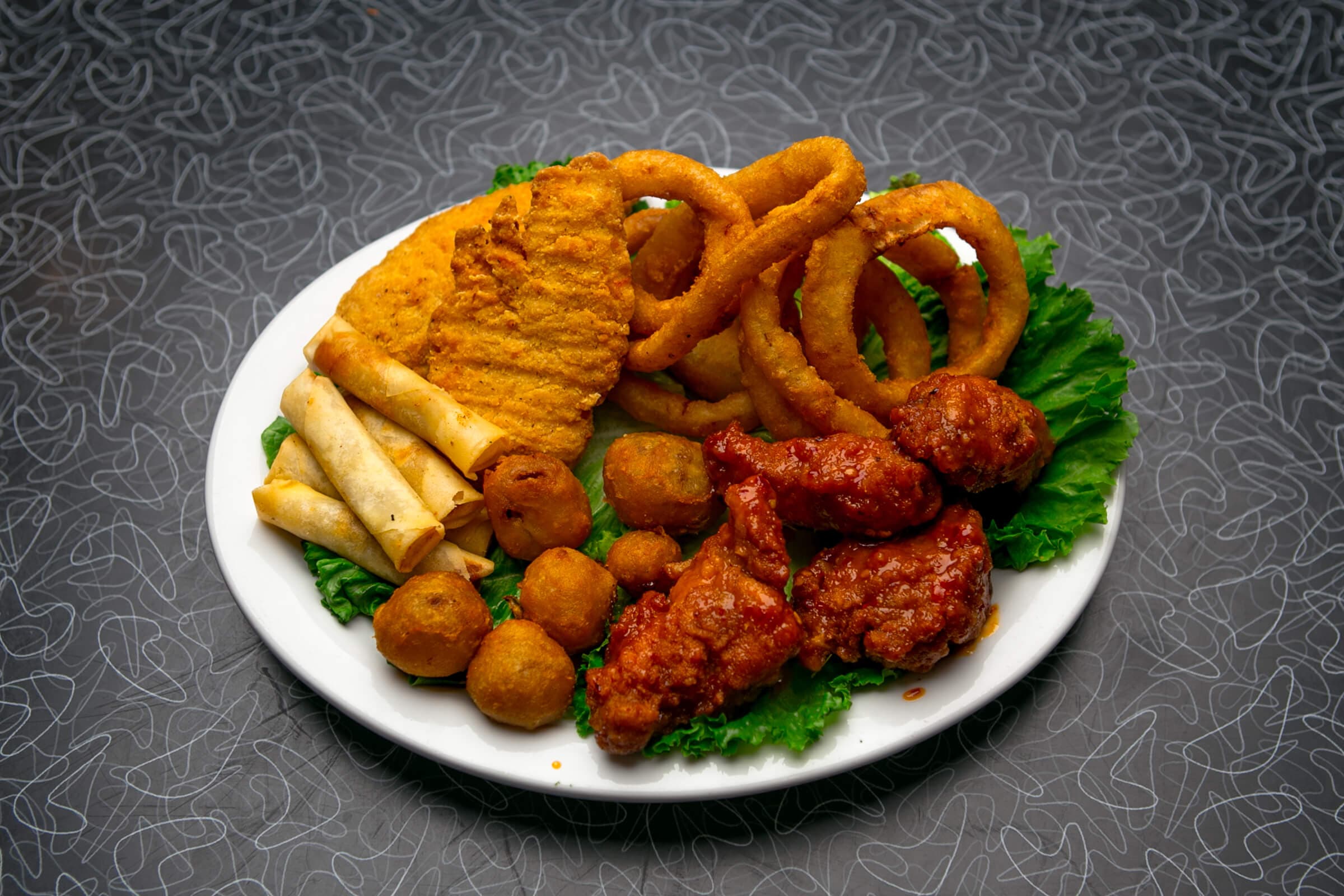 1. 1/2 Pound Wings, Onion Rings, Spring Rolls, Battered Mushrooms, and Chicken Fingers