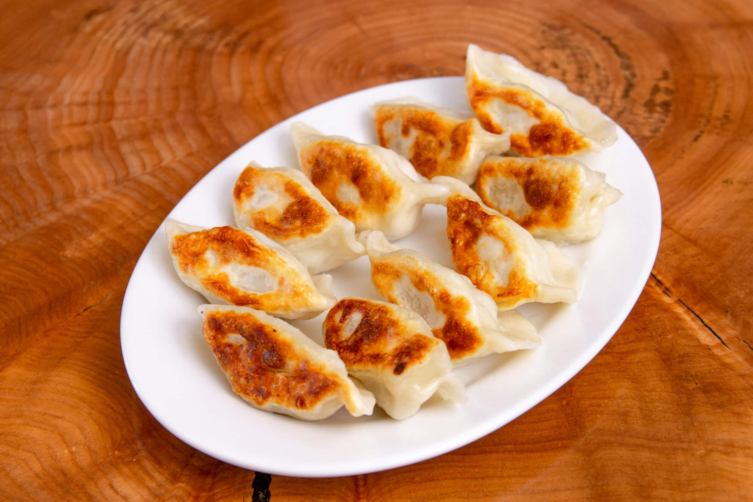 136. Grilled Pork Dumplings (10 pcs)