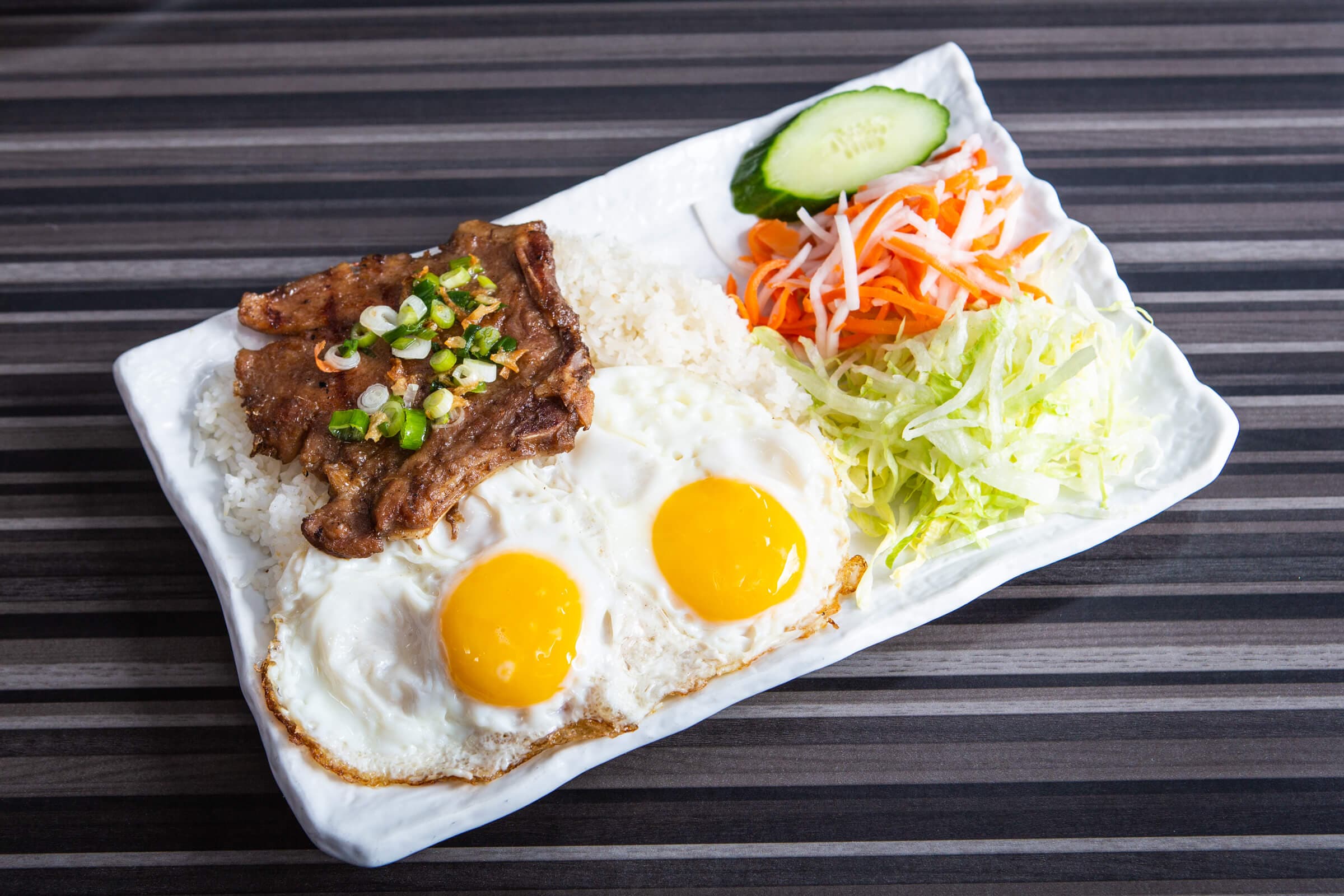 56. BBQ Pork Chop and Fried Eggs on Steamed Rice