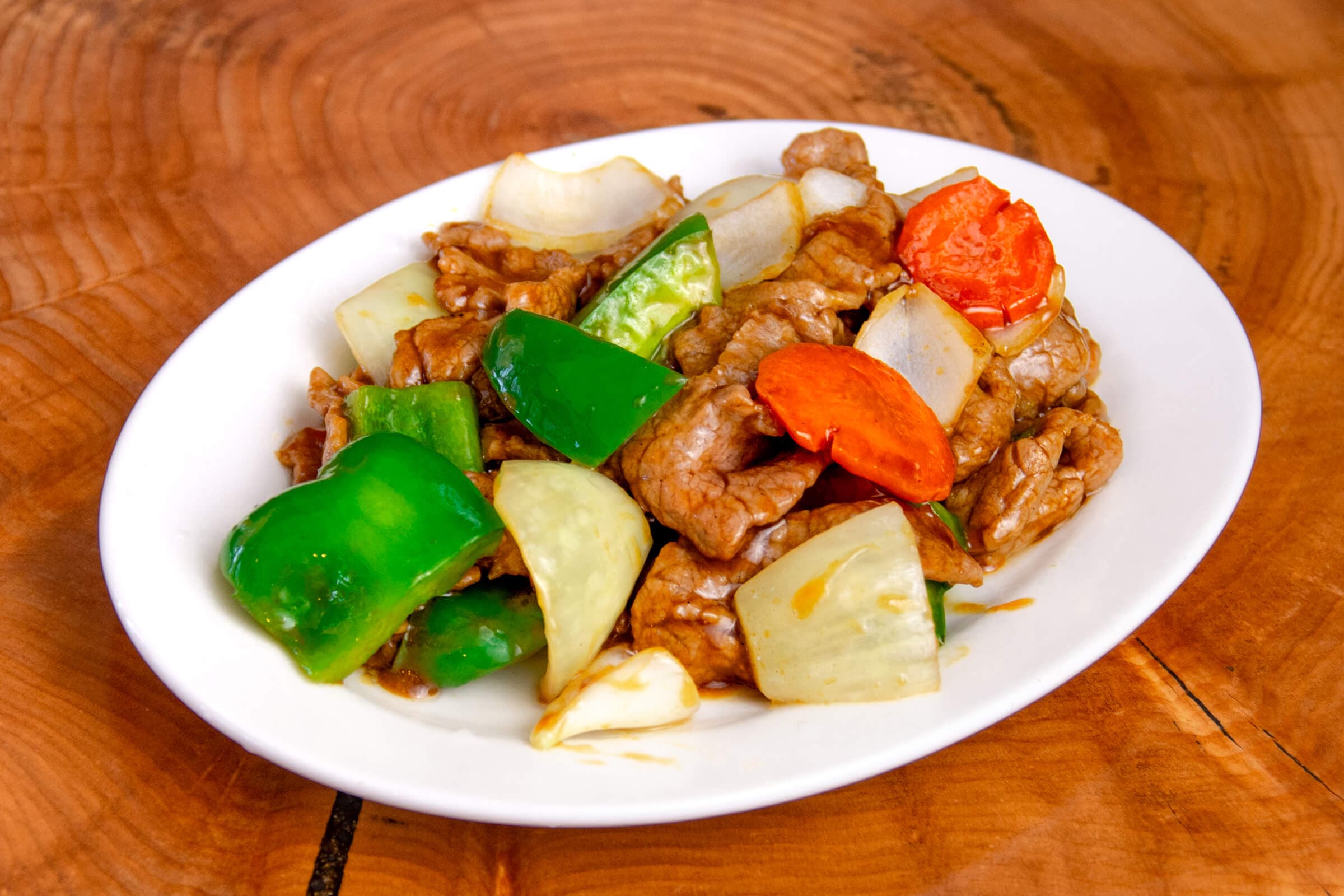 28. Stir-Fried with Szechuan Style with Peppers, Onions, and Mushrooms in a Spicy Chili Sauce