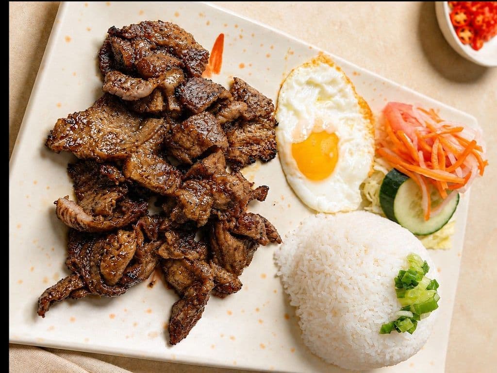 533. Grilled Pork Pieces and Fried Egg on Rice