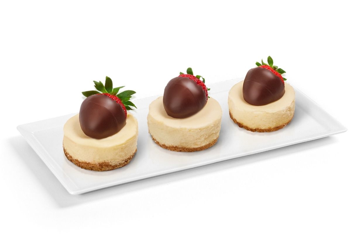 Three Cheesecake topped with Semi Dipped Strawberries