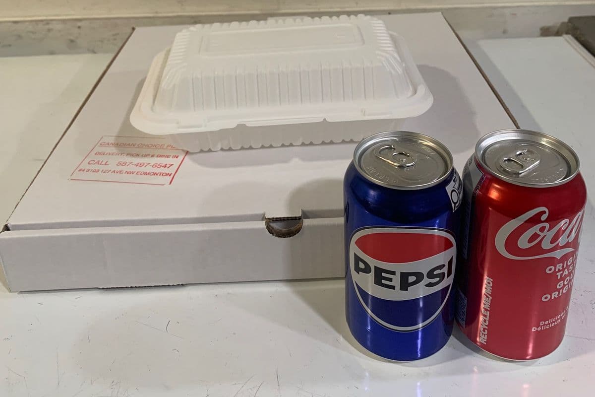 (Meal for Two) 12" Medium pizza (up to Four Toppings), 10 pieces Chicken wings or Cheesy Bread and two Can of pop