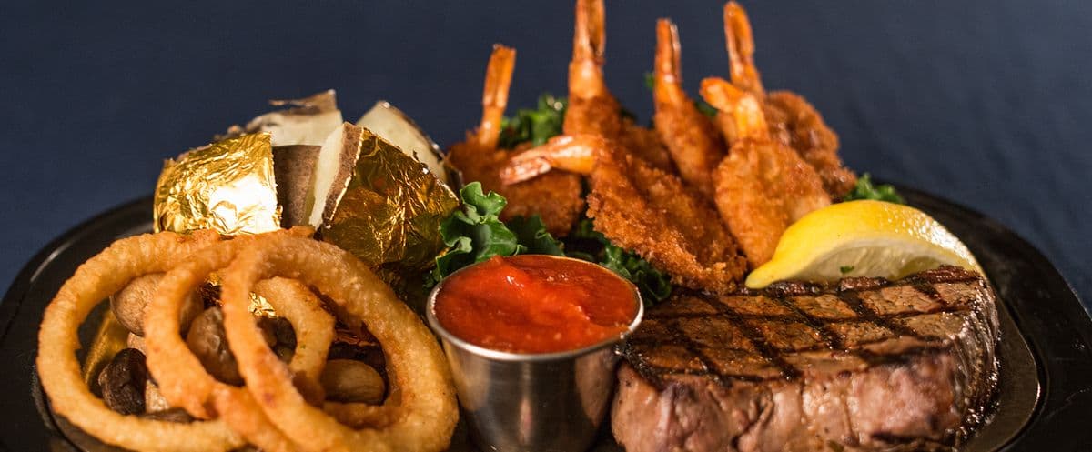 Steak and Garlic Tiger Prawns