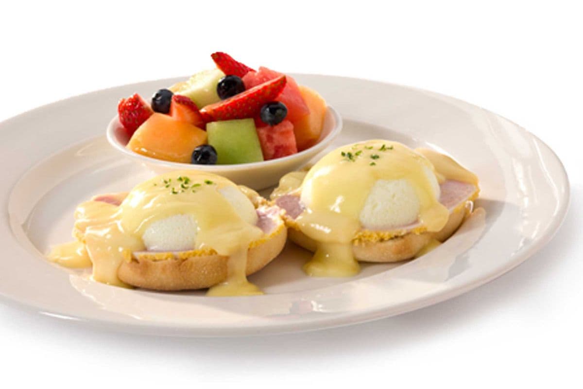 Eggs Benedict with Peameal and Fruits