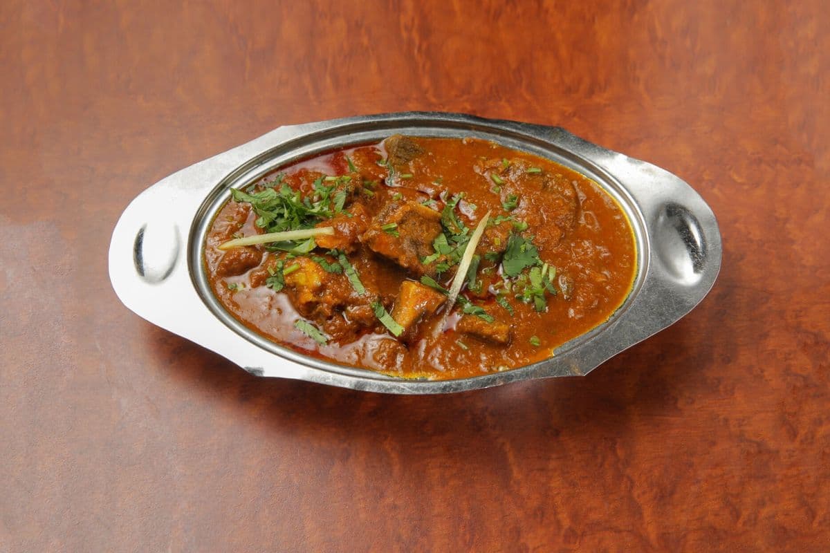 GOAT CURRY ( BONE IN )