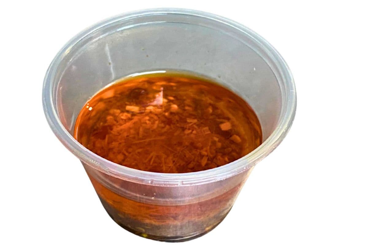 E100. Satay Oil Sauce (2 oz)