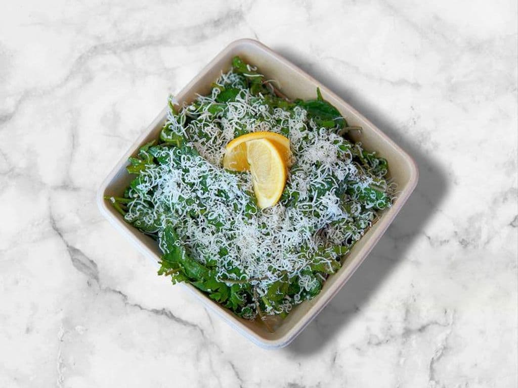 Shareable Baby Kale Caesar Salad
