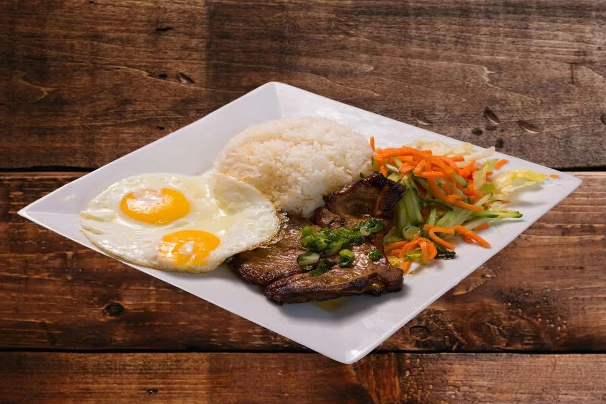 57. Grilled Pork Chop (1 pc) with Eggs (2 pcs) on Rice
