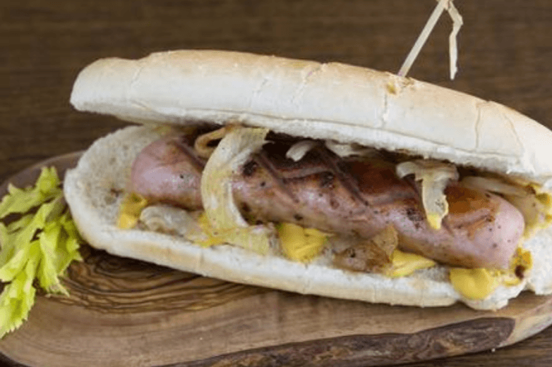 German Oktoberfest Sausage with Fried Onion on a Bun