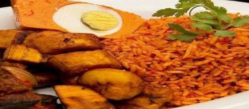 Jollof with Two Pieces of Meat or Fish with Topping (Dodo, Moi Moi, or Salad)