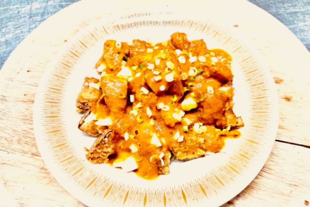 DCS BUTTER CHICKEN POUTINE $15