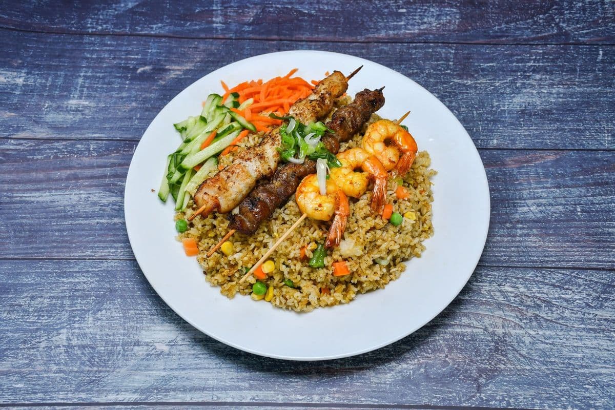 52. Satay Chicken, Beef, and Shrimp Skewers on Fried Rice