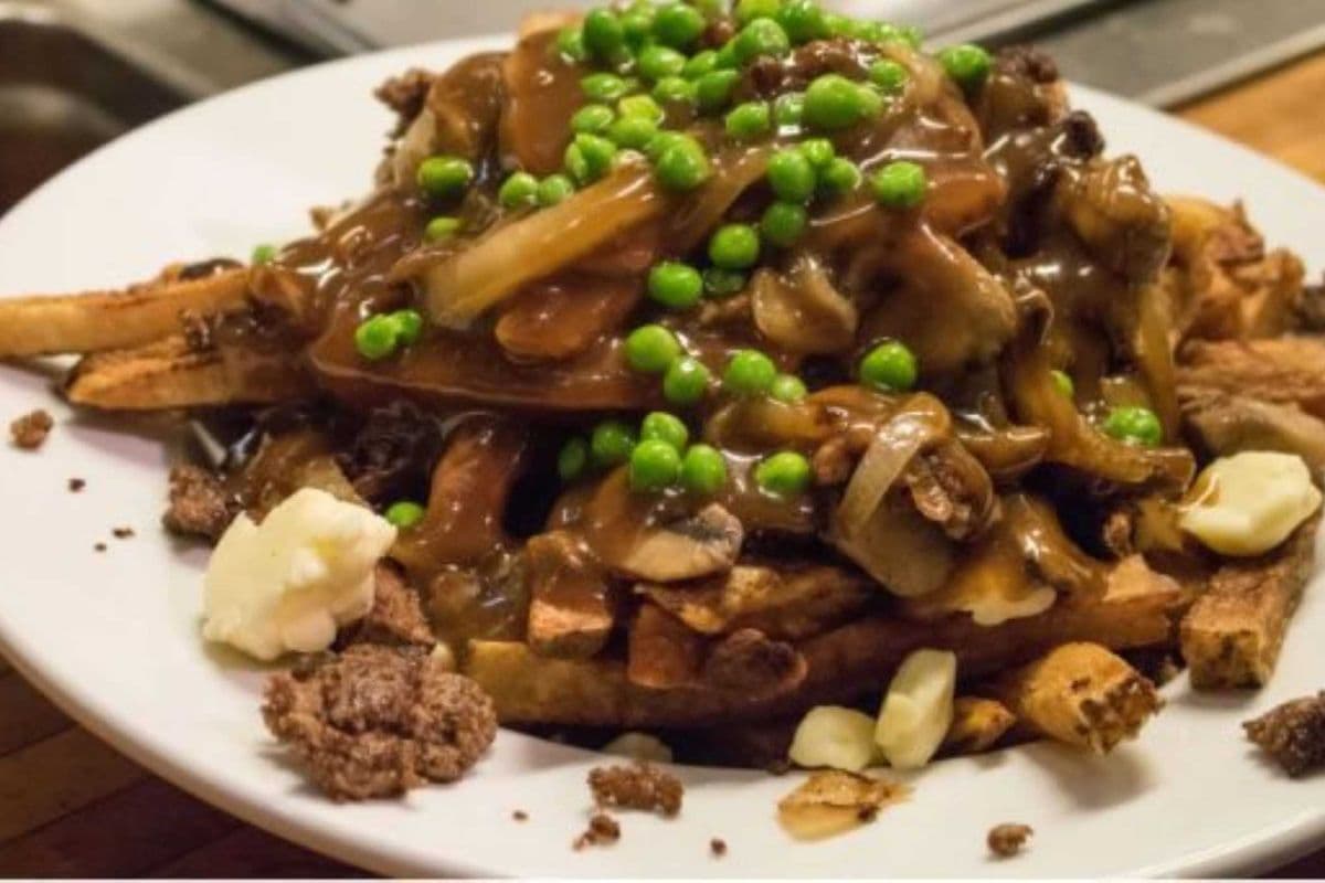 Fries with Works Fries, cheese, ground beef, onions, and peas topped with gravy.