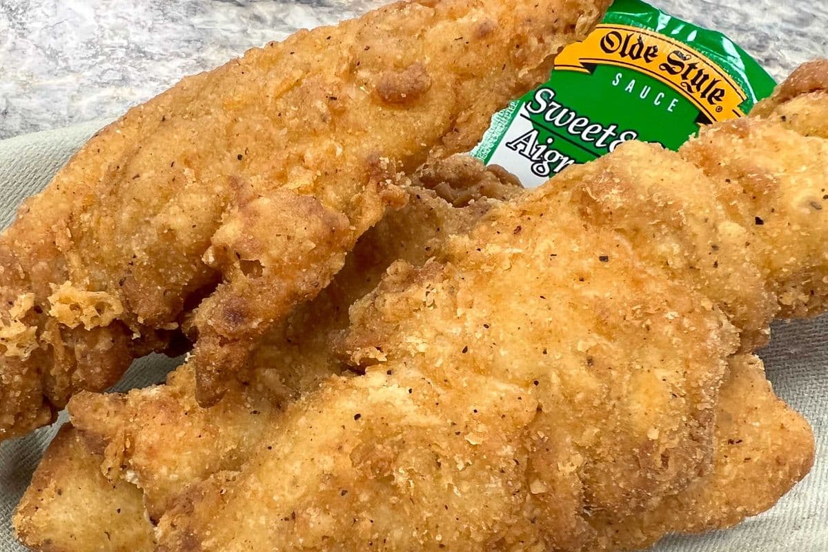 Four Chicken Tenders with Dipping Sauce and Fries