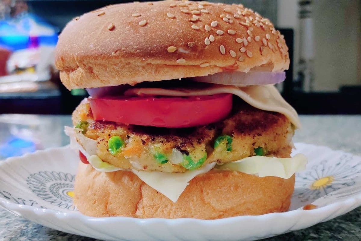 Paneer noodle tikki burger with fries and pop