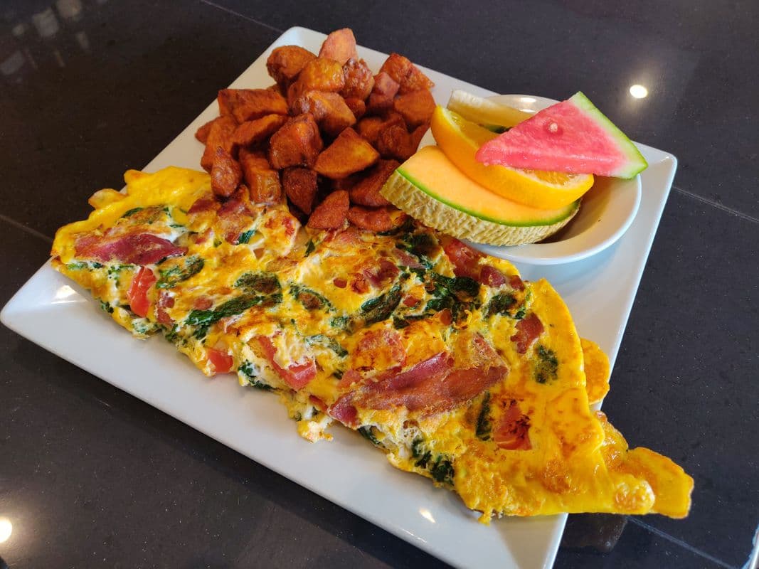 Spinach Omelette with Bacon, Tomatoes, and Swiss Cheese