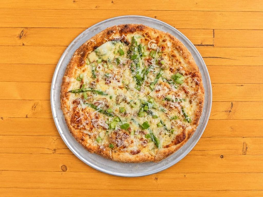 community love feature pizza: asparagus carbonara pizza