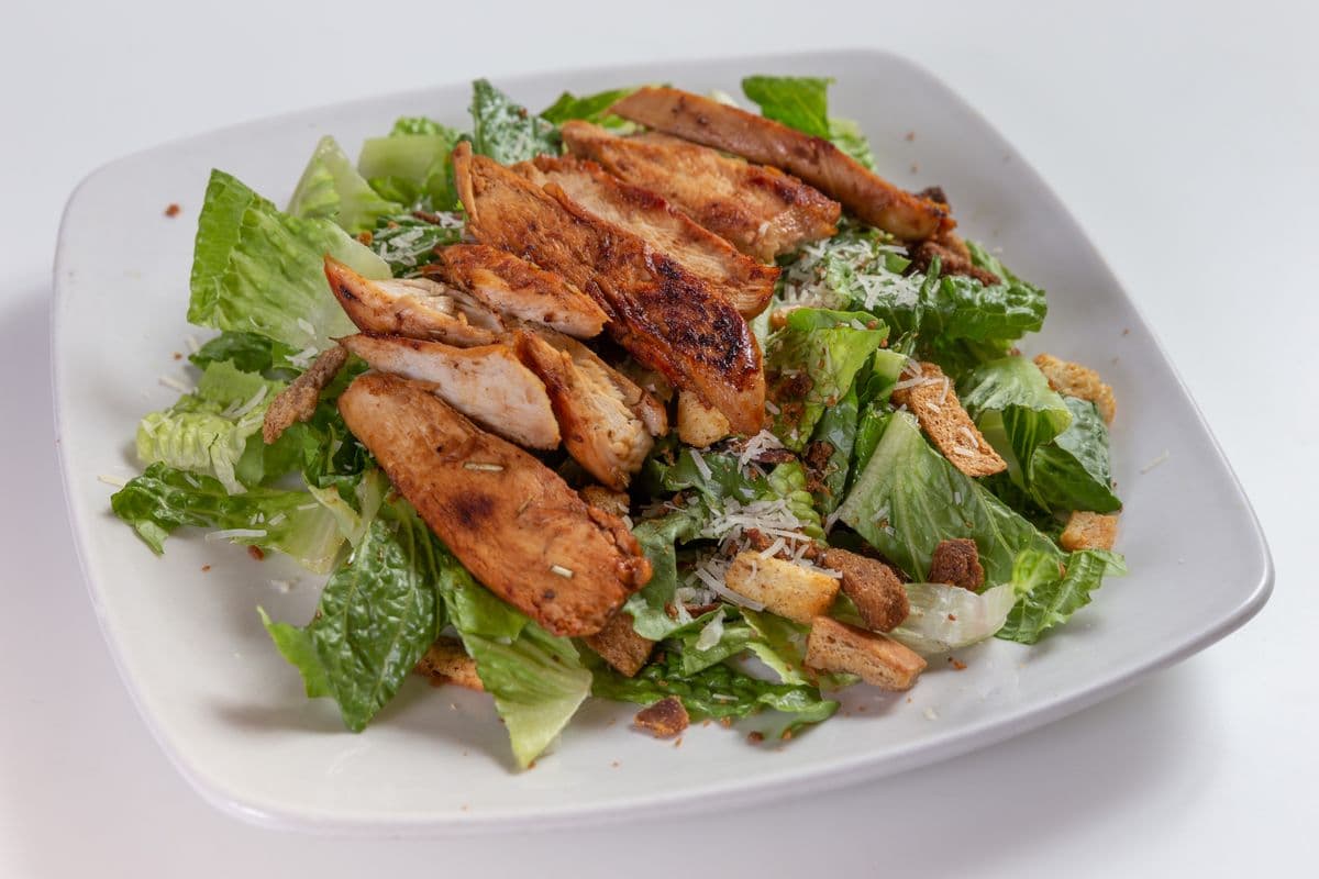 Grilled Chicken Caesar Salad with garlic bread