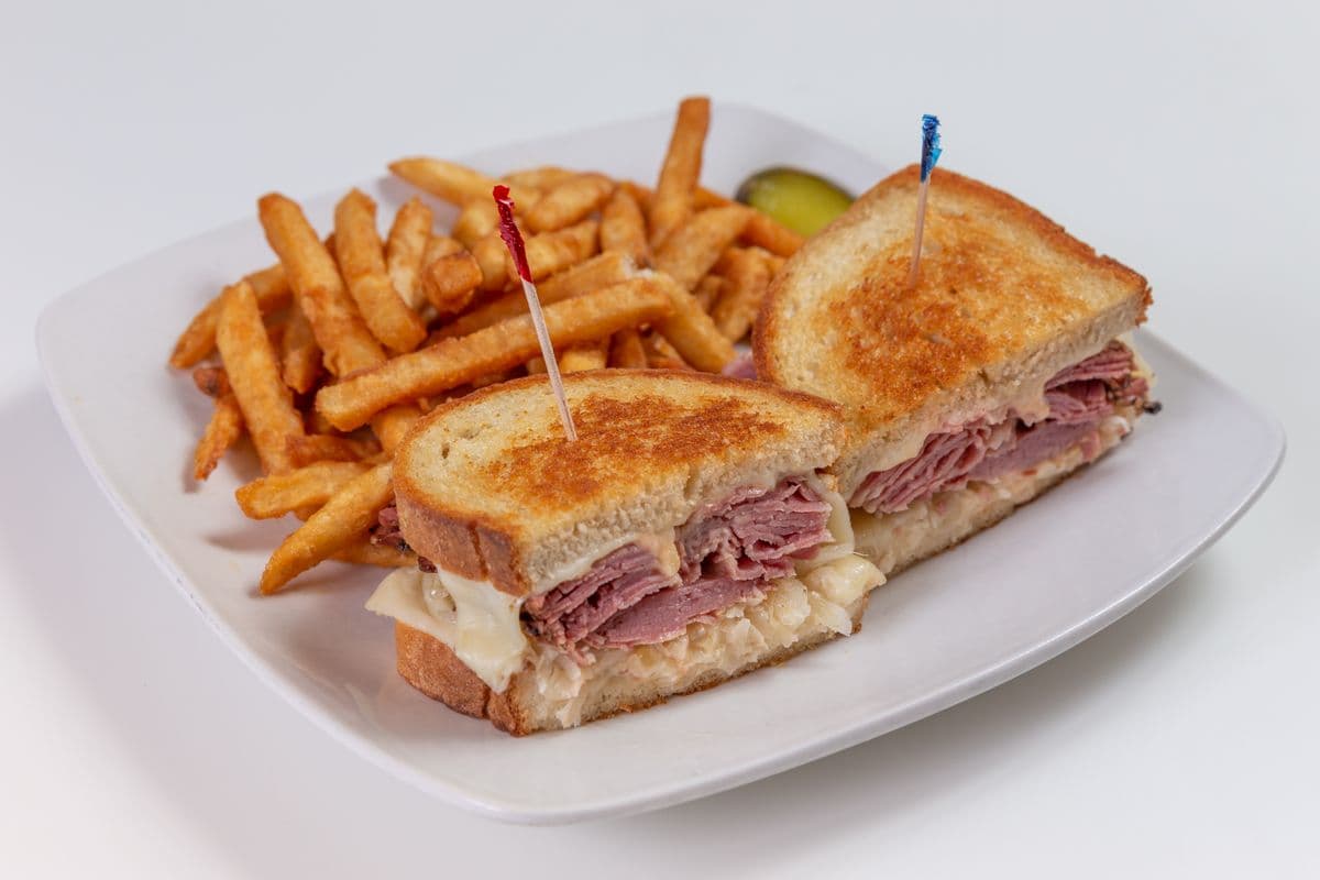 Rueben Sandwich With French fries.